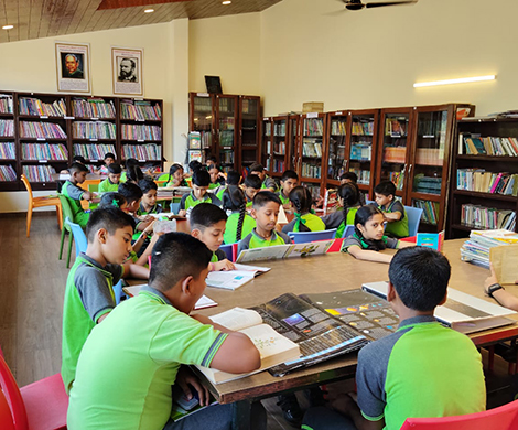 KVN College library interior with students reading and studying